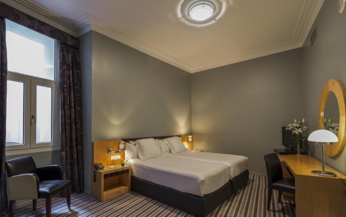 Slaapkamer van hotel Room Mate Larios in Malaga