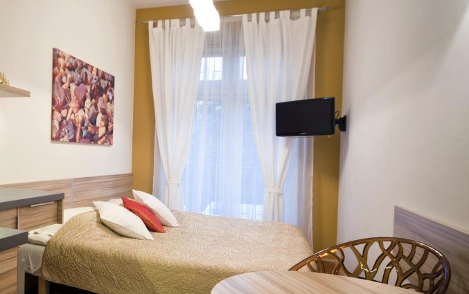 Slaapkamer van een appartement van Appartementen 4Seasons in Krakau