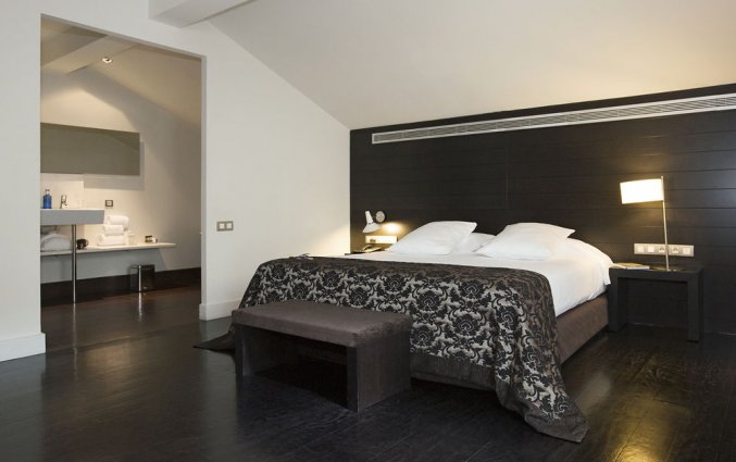 Slaapkamer van hotel Hospes Palau de La Mar in Valencia